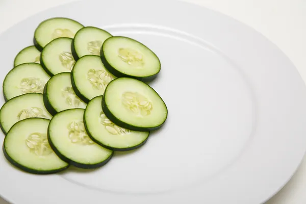 Sliced Cucumbers on a White Plate — Stock Photo, Image