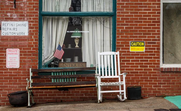 White Rocking Chair in Front of Antique Shop — Stock Photo, Image