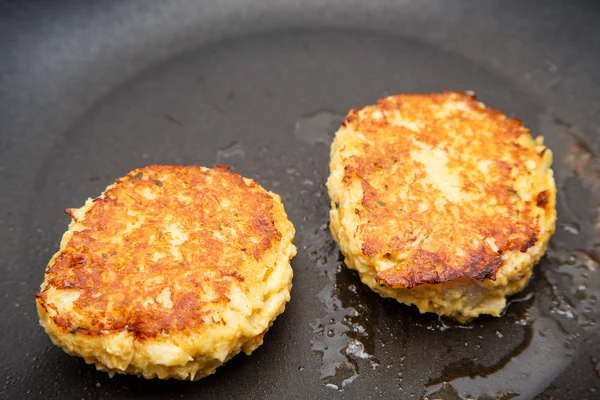 Two Crab Cakes Browning in Saute Pan — Stock Photo, Image