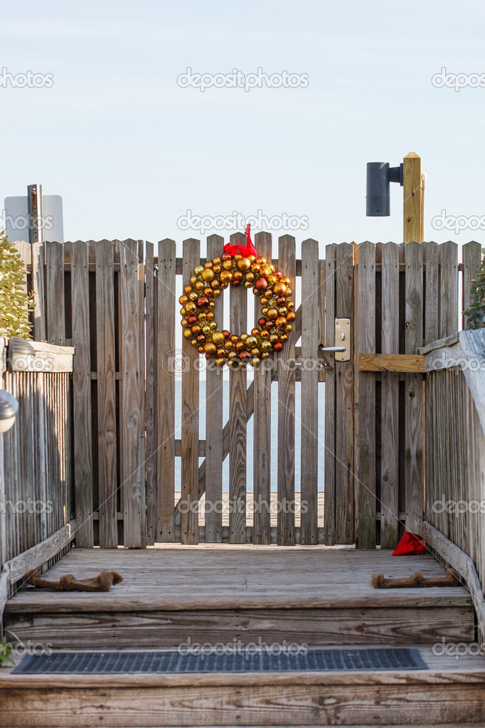 Gold Christmas Wreath on Gate to Beach