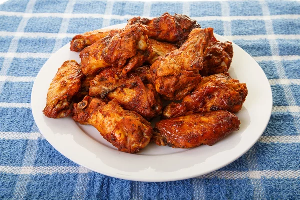 Mesquite Wings on Blue Placemat — Stock Photo, Image