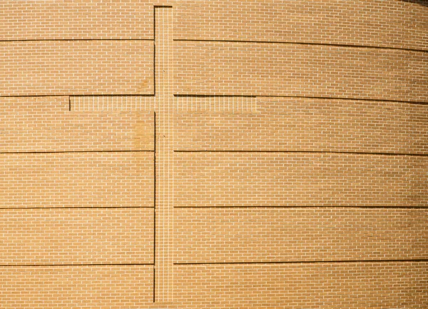 Cross in Curved Brick Wall of Church — Stock Photo, Image