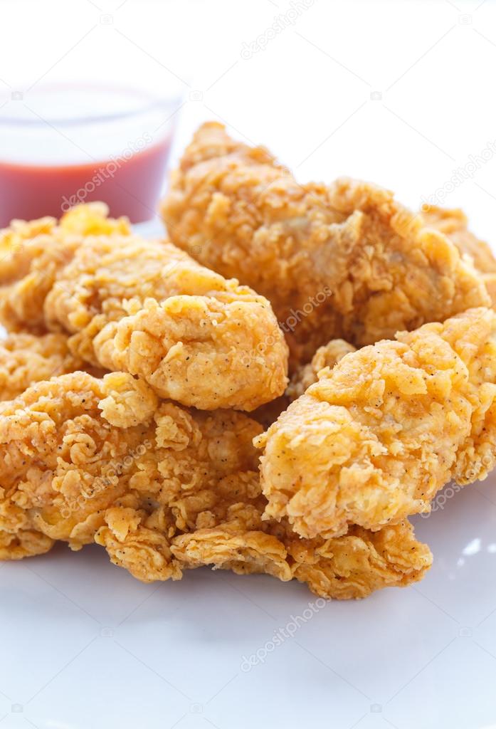 Chicken Strips on White with Hot Sauce