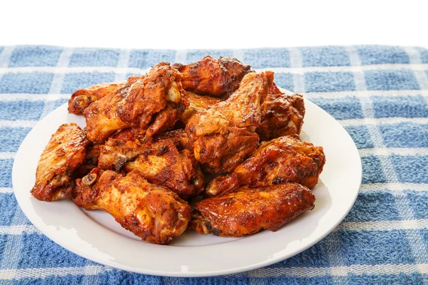 White Plate of Chicken Wings on Blue Mat — Stock Photo, Image