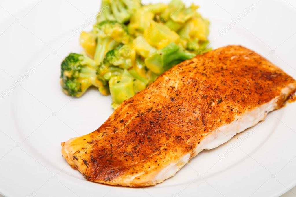Baked Salmon and Broccoli with Cheese Sauce Stock Photo by ©dbvirago