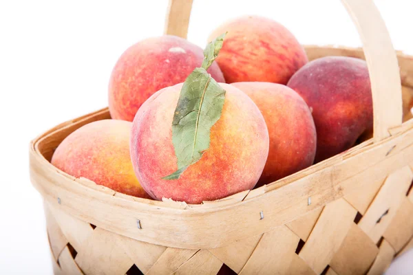 Closeup of Baskets of Peaches on White Background — Stock Photo, Image