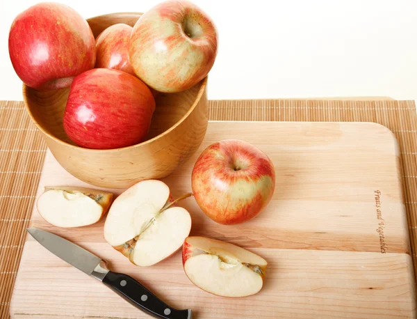 Cutting Apples on Wood Cutting Board Stock Image