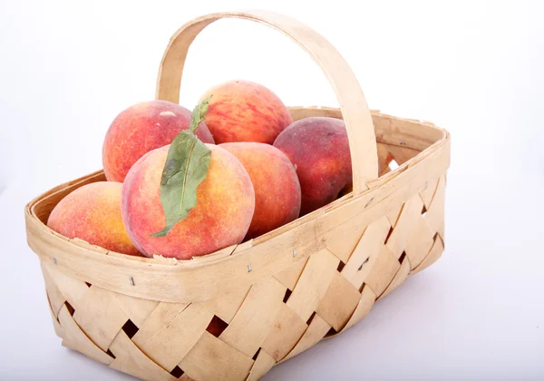 Green Leaf on Peach in Basket — Stock Photo, Image