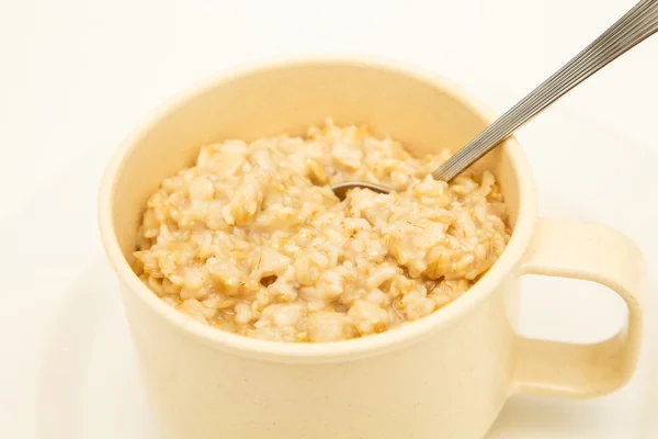 Fresh Hot Oatmeal in a Mug with Spoon — Stock Photo, Image