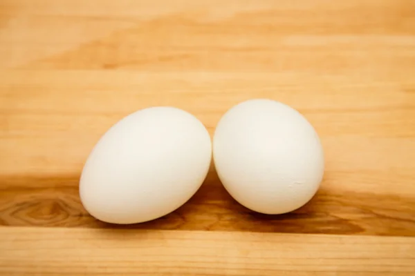 Two Eggs on Wood Board — Stock Photo, Image