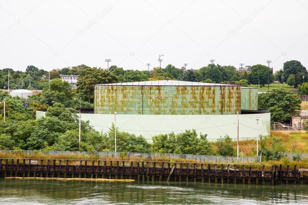 Green Water Tank on Edge of Canal