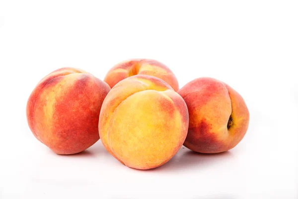Four Peaches on White — Stock Photo, Image