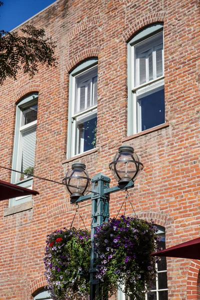 Planters on Lamp par Old Brick Wall — Photo