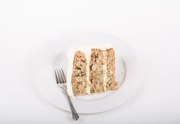 Fetta di torta colibrì su piatto bianco con forchetta . — Foto Stock