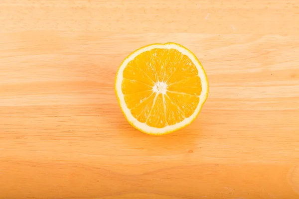 Half Orange on Wood Table — Stock Photo, Image