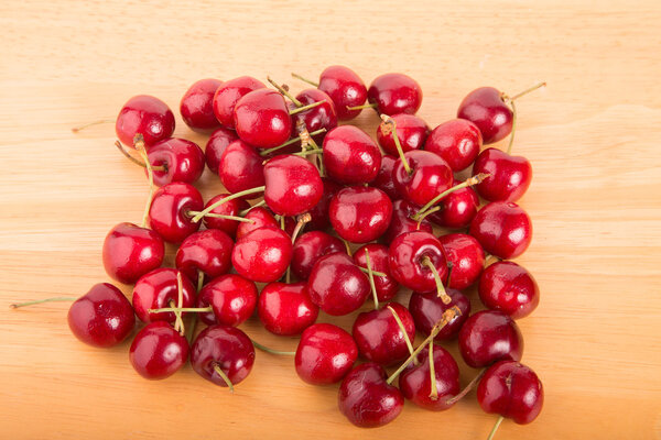 Red Cherries on a Wood Table