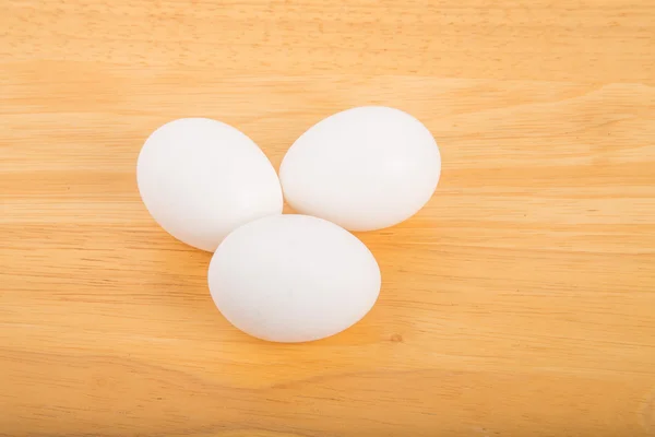 Three Eggs on Wood Table — Stock Photo, Image