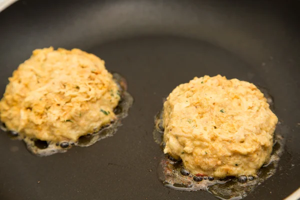 Two Fresh Crab Cakes Cooking in Oil — Stock Photo, Image