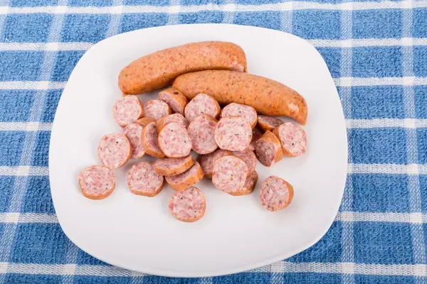 While and Sliced Sausage on a Plate — Stock Photo, Image