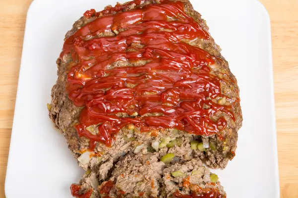 Fresh Baked Meatloaf on White Cutting Board — Stock Photo, Image