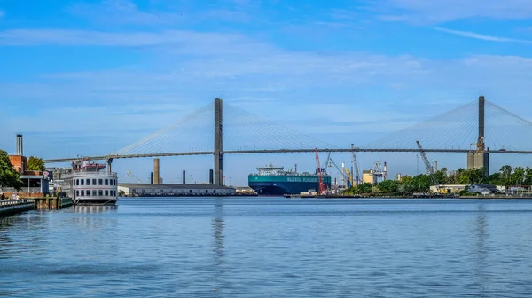 Freighter and Riverboat by Talmadge Bridge in Savannah — стоковое фото