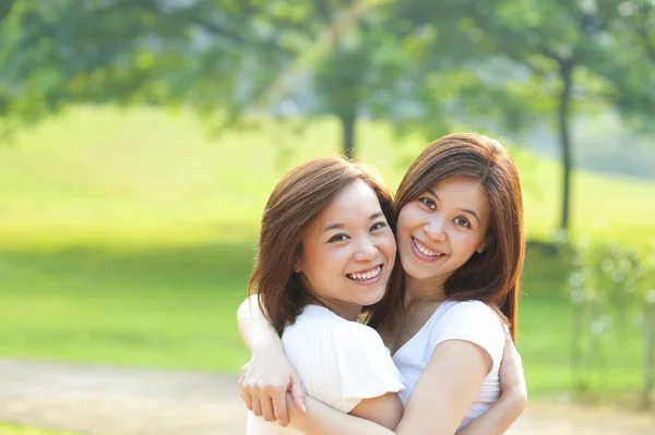 Two Asian girls having fun — Stock Photo, Image