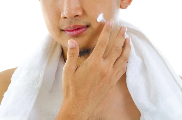 Man toepassing lotion — Stockfoto