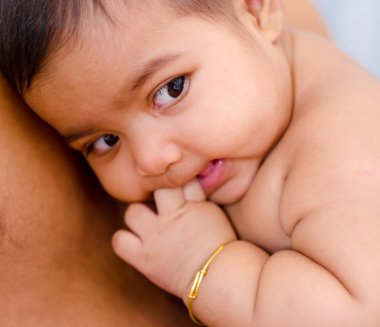 Baby lying on daddy chest clipart