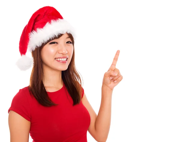 Christmas girl pointing on blank space — Stock Photo, Image