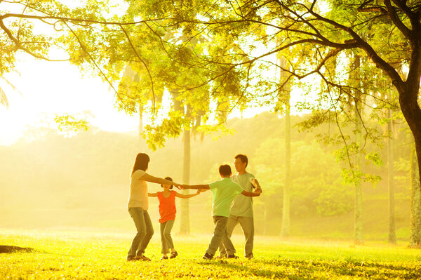 Happy Asian family playing