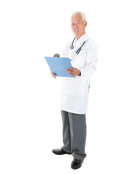 Full body Asian senior doctor reading medical report — Stock Photo, Image