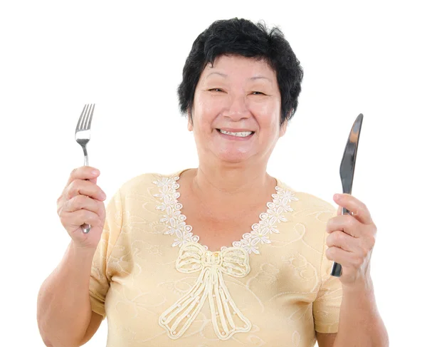 Senior Asian having meal — Stock Photo, Image