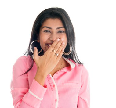 Indian woman giggles covering her mouth with hand clipart