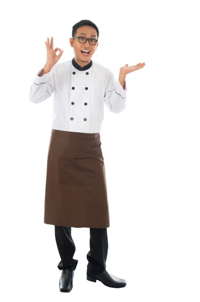 Asian male chef showing copy space and okay hand sign — Stock Photo, Image