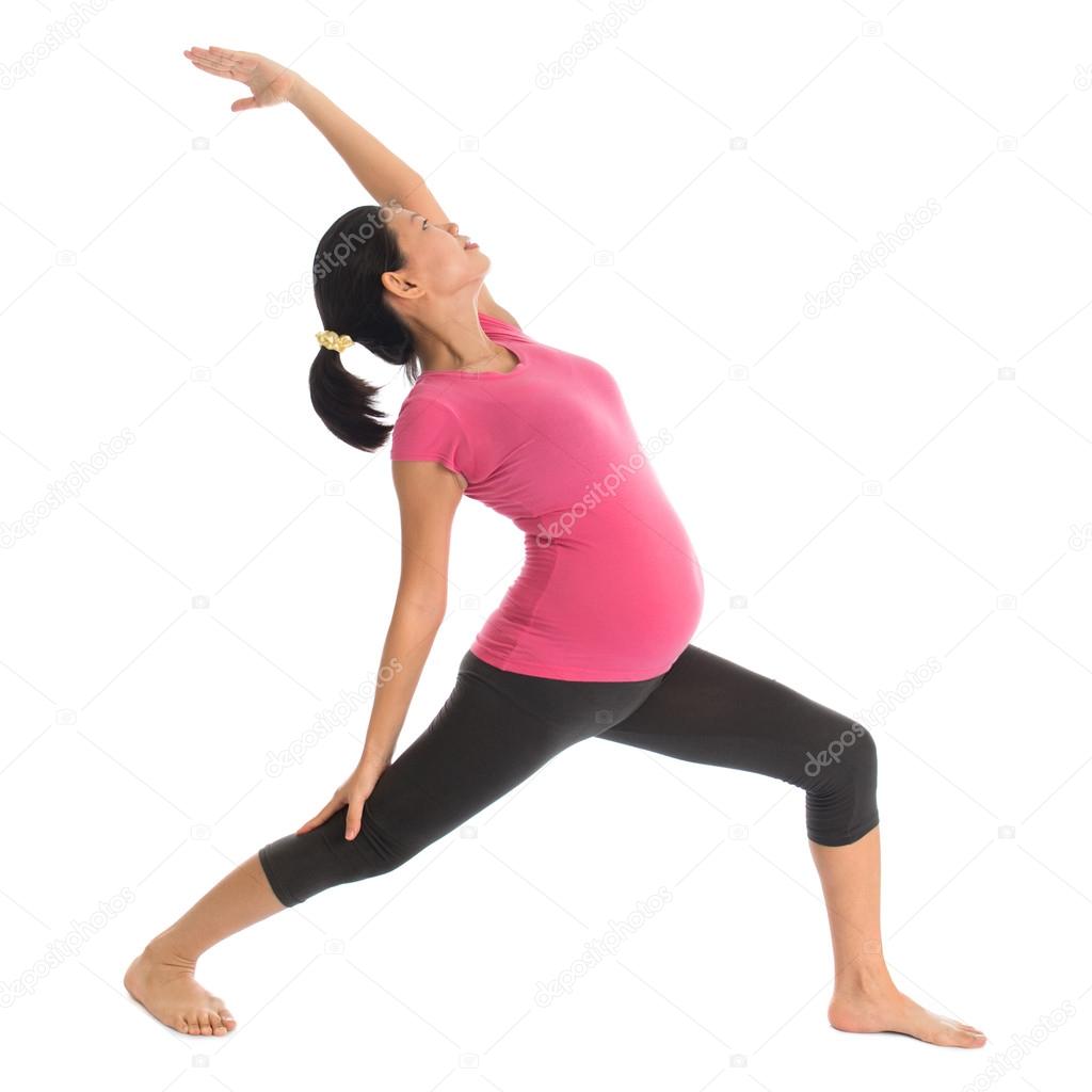 Asian pregnant yoga exercise.