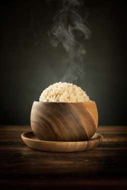 Cooked organic basmati brown rice with steam clipart