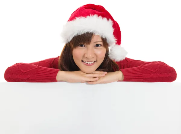 Christmas santa woman showing blank billboard sign. — Stock Photo, Image