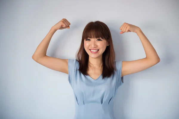 Funny strong muscle Asian woman — Stockfoto