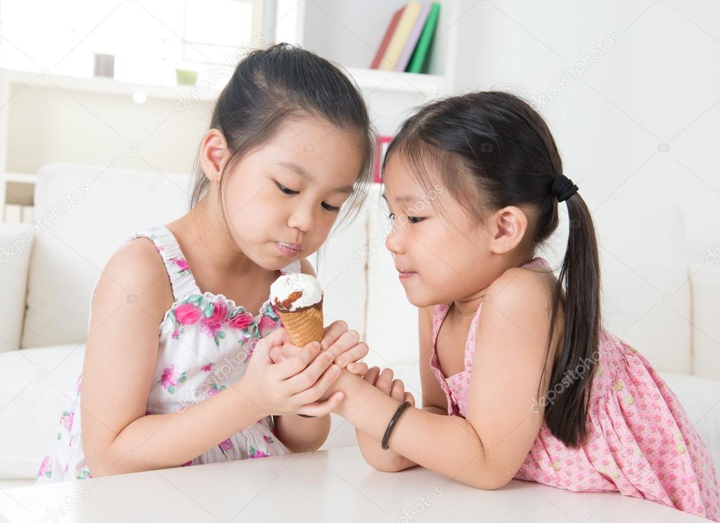 Children eating ice cream cone