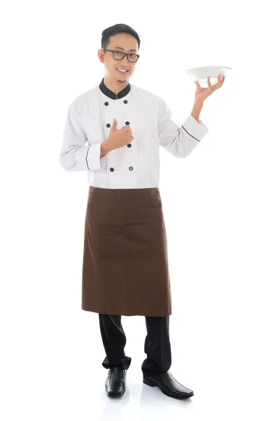 Asian male chef holding a plate — Stock Photo, Image