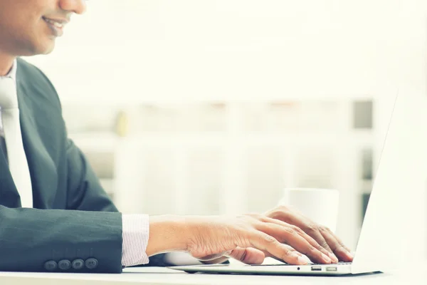 Indian business man using laptop — Stock Photo, Image