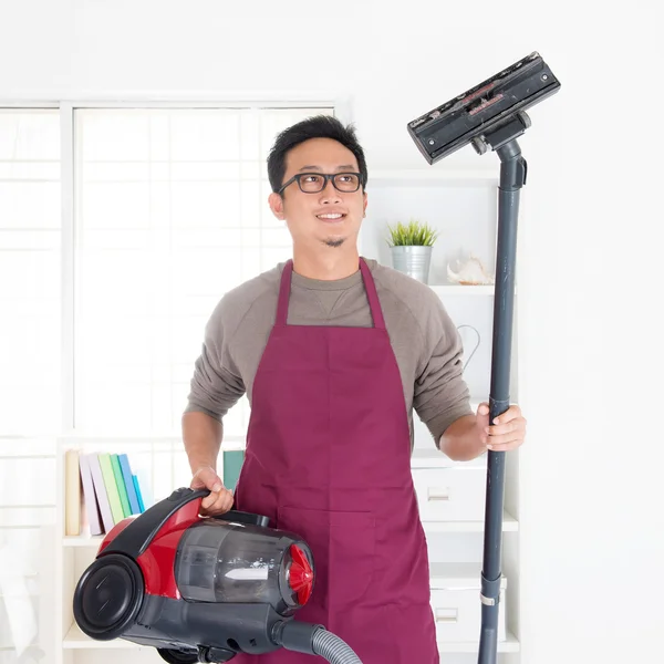 Asian man vacuuming — Stock Photo, Image