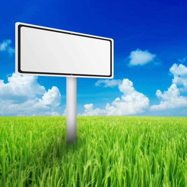 Billboard in the green field — Stock Photo, Image