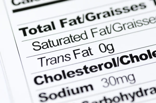 Voedingswaarde-etiket gericht op trans fat inhoud concept gezond eten — Stockfoto