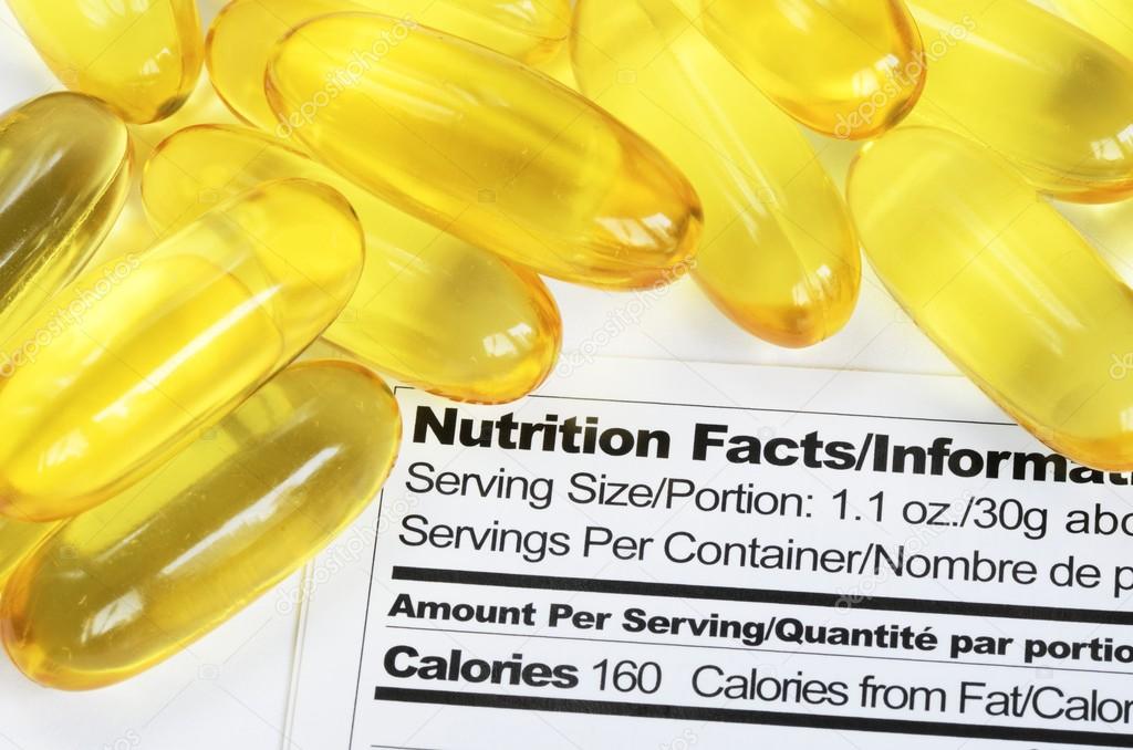 Nutrition label with fish oil pills concept healthy eating — Stock