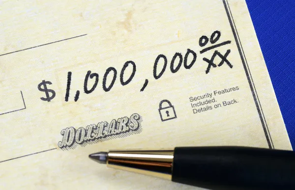 Write a check of one million dollars concept of wealth — Stock Photo, Image