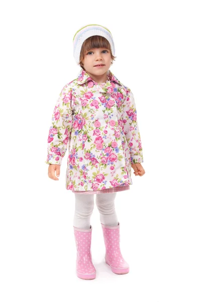 Little girl in boots and a jacket in the studio — Stock Photo, Image