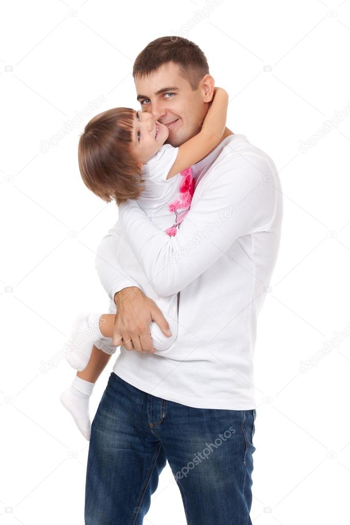 Studio portrait of loving young father hugging his child