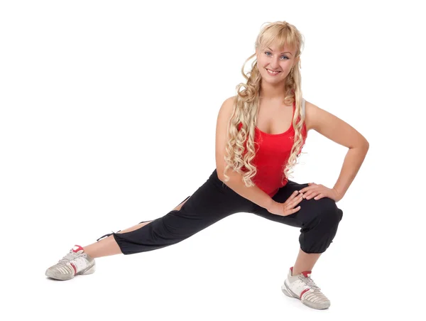 Schöne junge Blondine ist in Fitness engagiert, demonstriert die f — Stockfoto