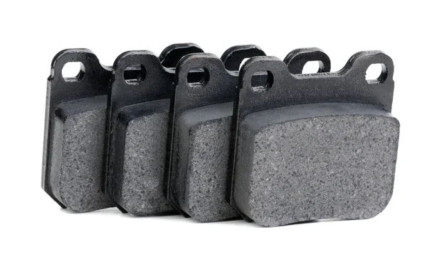 Almofadas de freio close-up no fundo branco — Fotografia de Stock